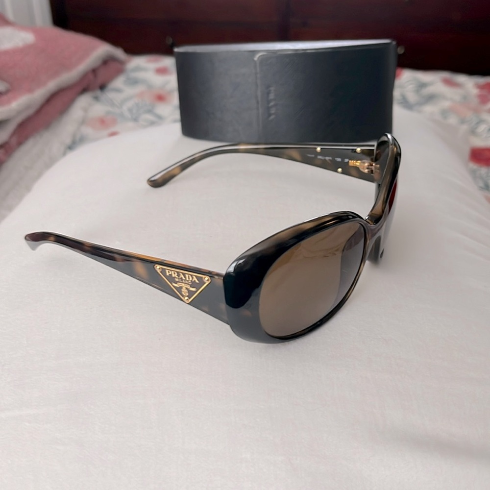 Prada Sunglasses with case. Made in Italy.